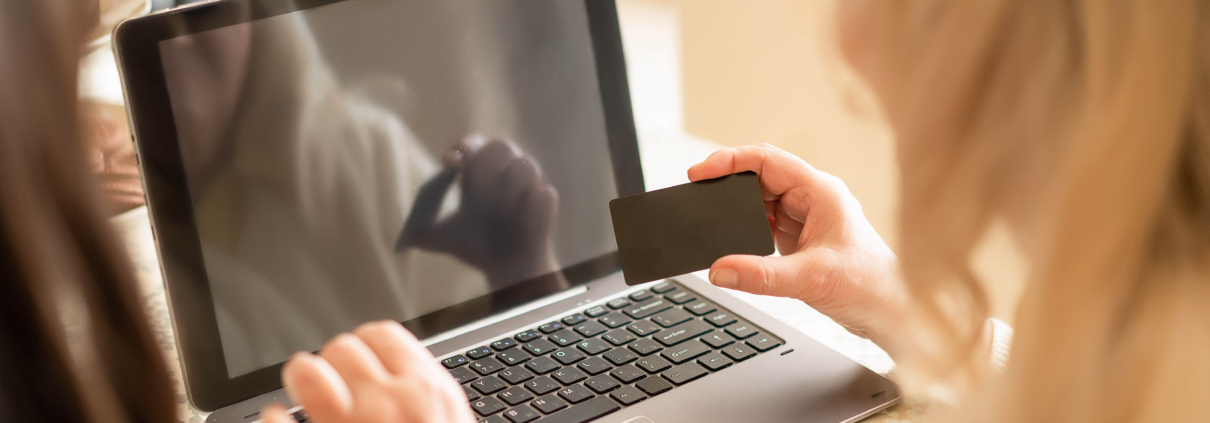 Hand Of Senior Lady Holding A Banking Card And Entering The Pin code For Checking Finance